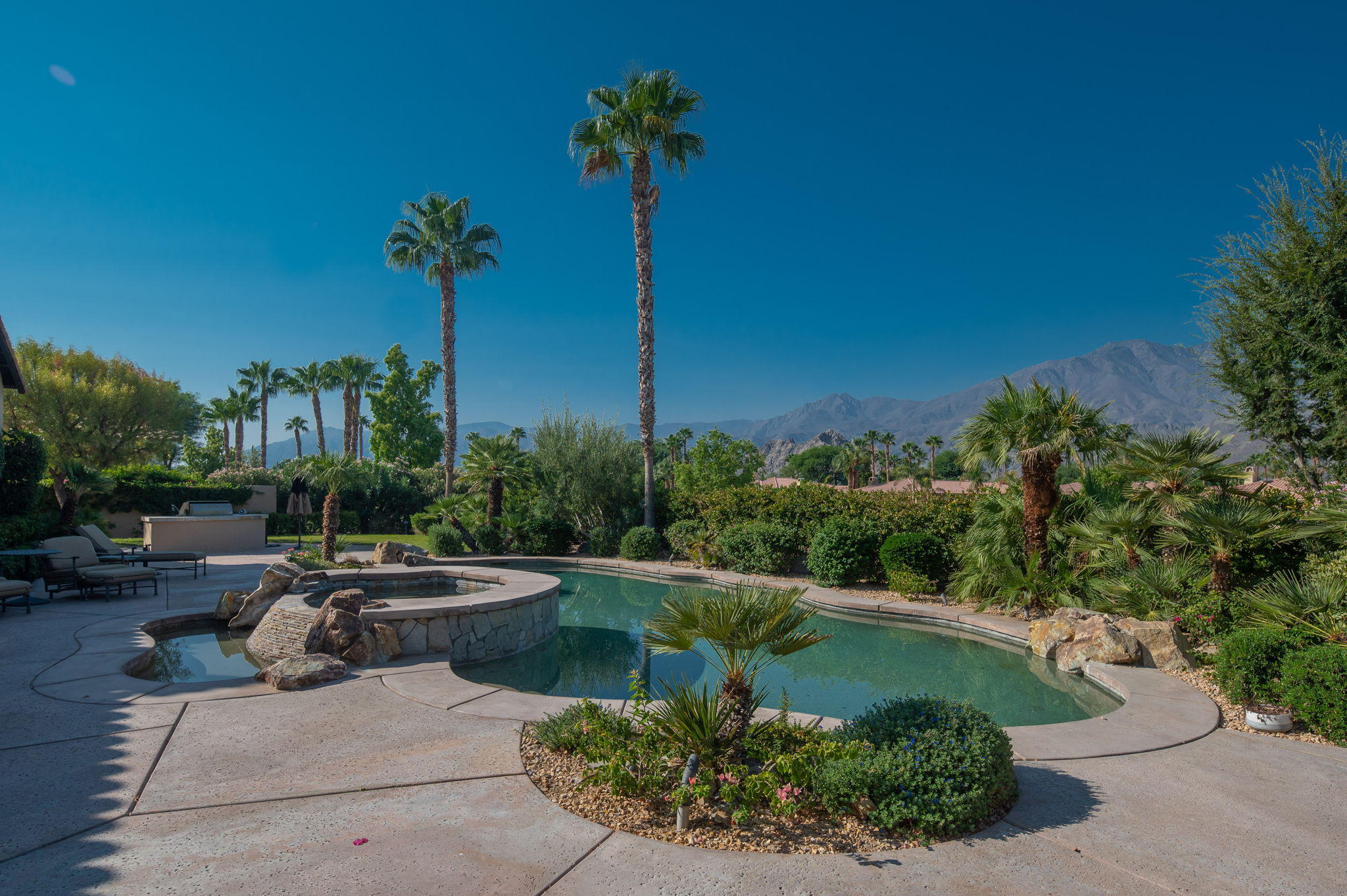 57325 Peninsula Lane La Quinta, CA 92253 - Photo 35 of 66 a view of a swimming pool with a patio