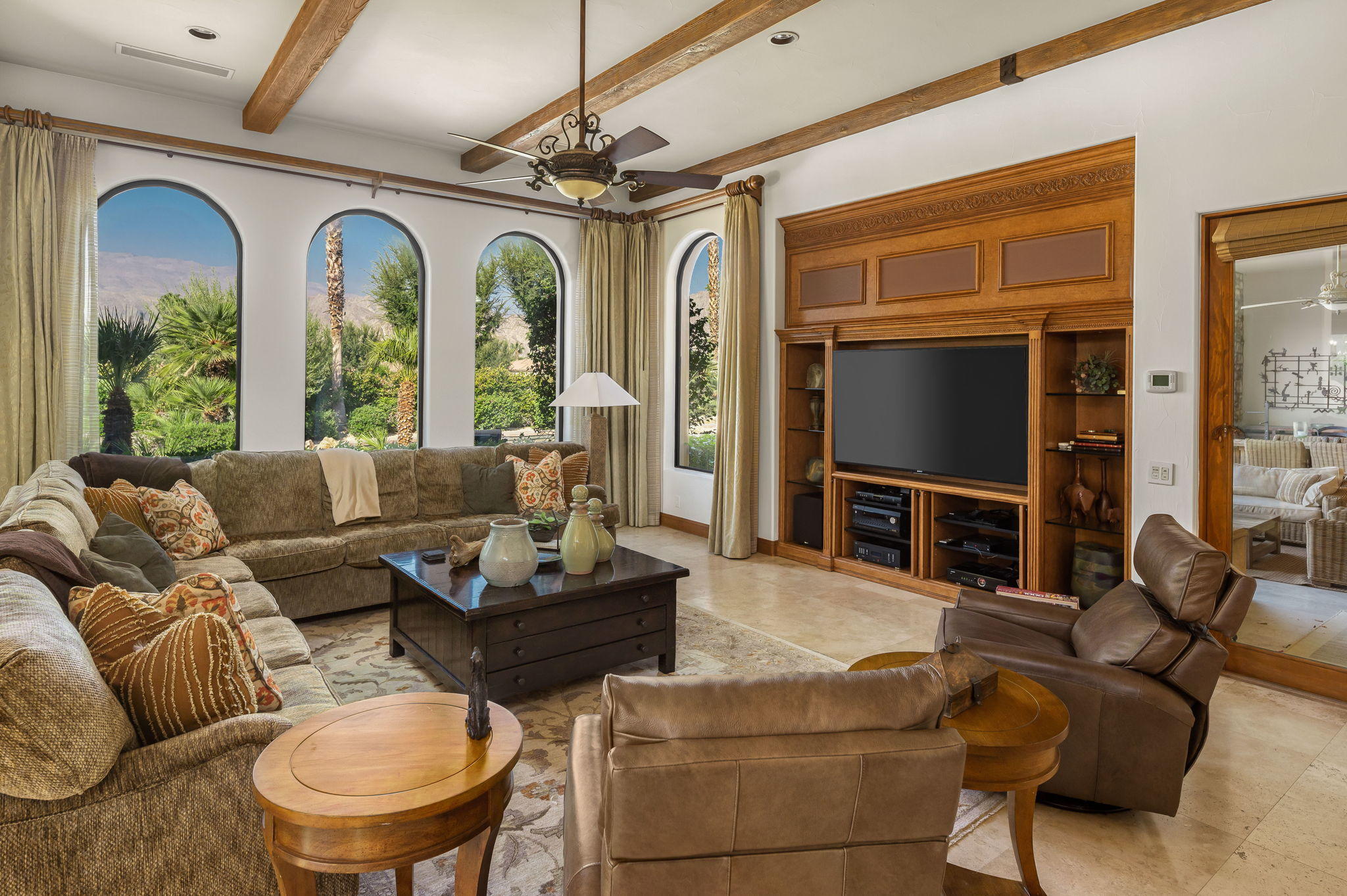 57325 Peninsula Lane La Quinta, CA 92253 - Photo 38 of 66 a living room with furniture a fireplace and a flat screen tv