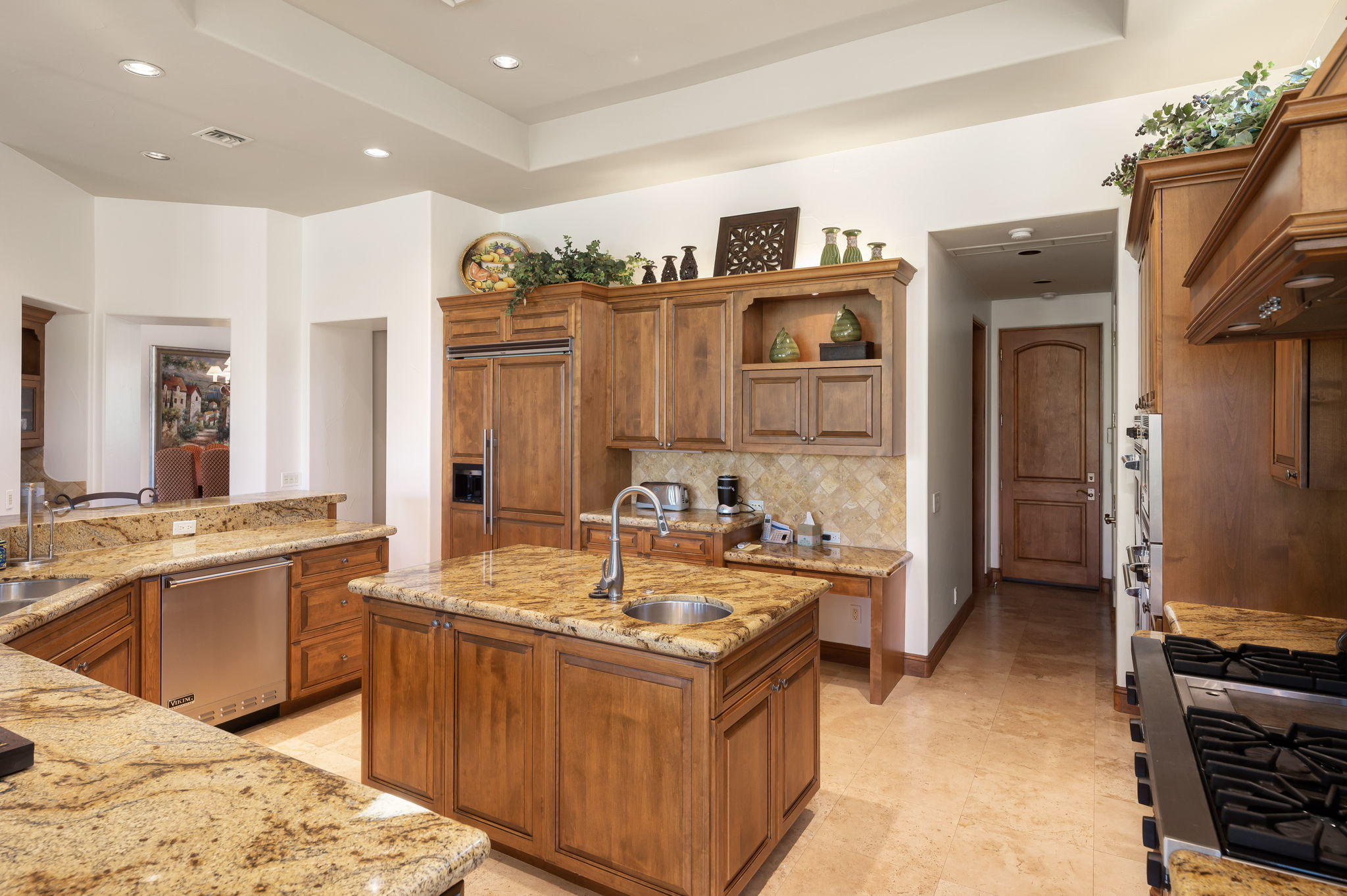 57325 Peninsula Lane La Quinta, CA 92253 - Photo 46 of 66 a kitchen with granite countertop a sink stove and refrigerator
