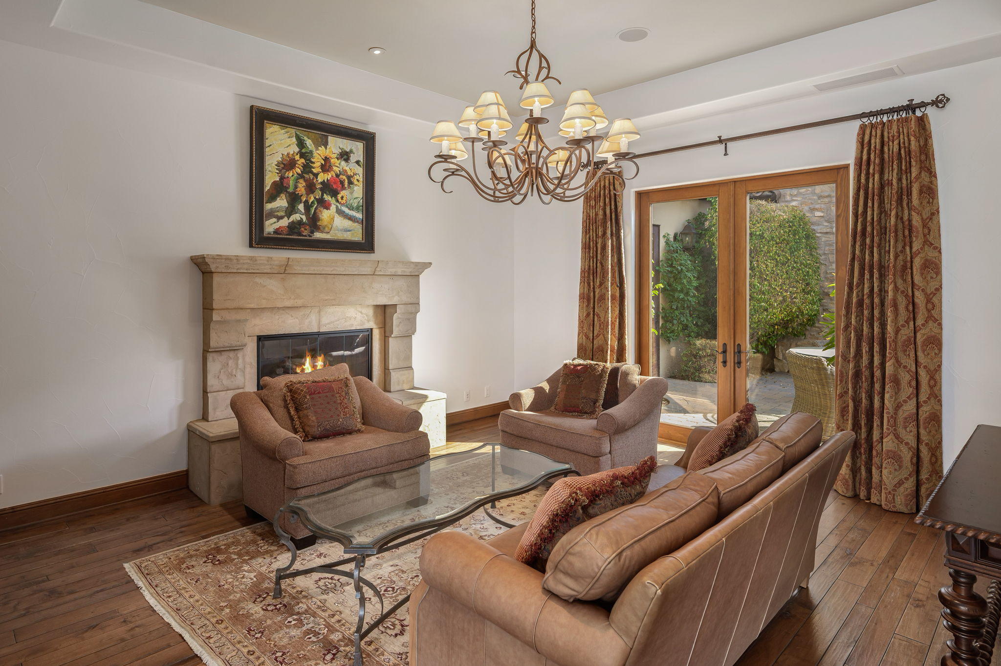 57325 Peninsula Lane La Quinta, CA 92253 - Photo 50 of 66 a living room with furniture a chandelier and a fireplace