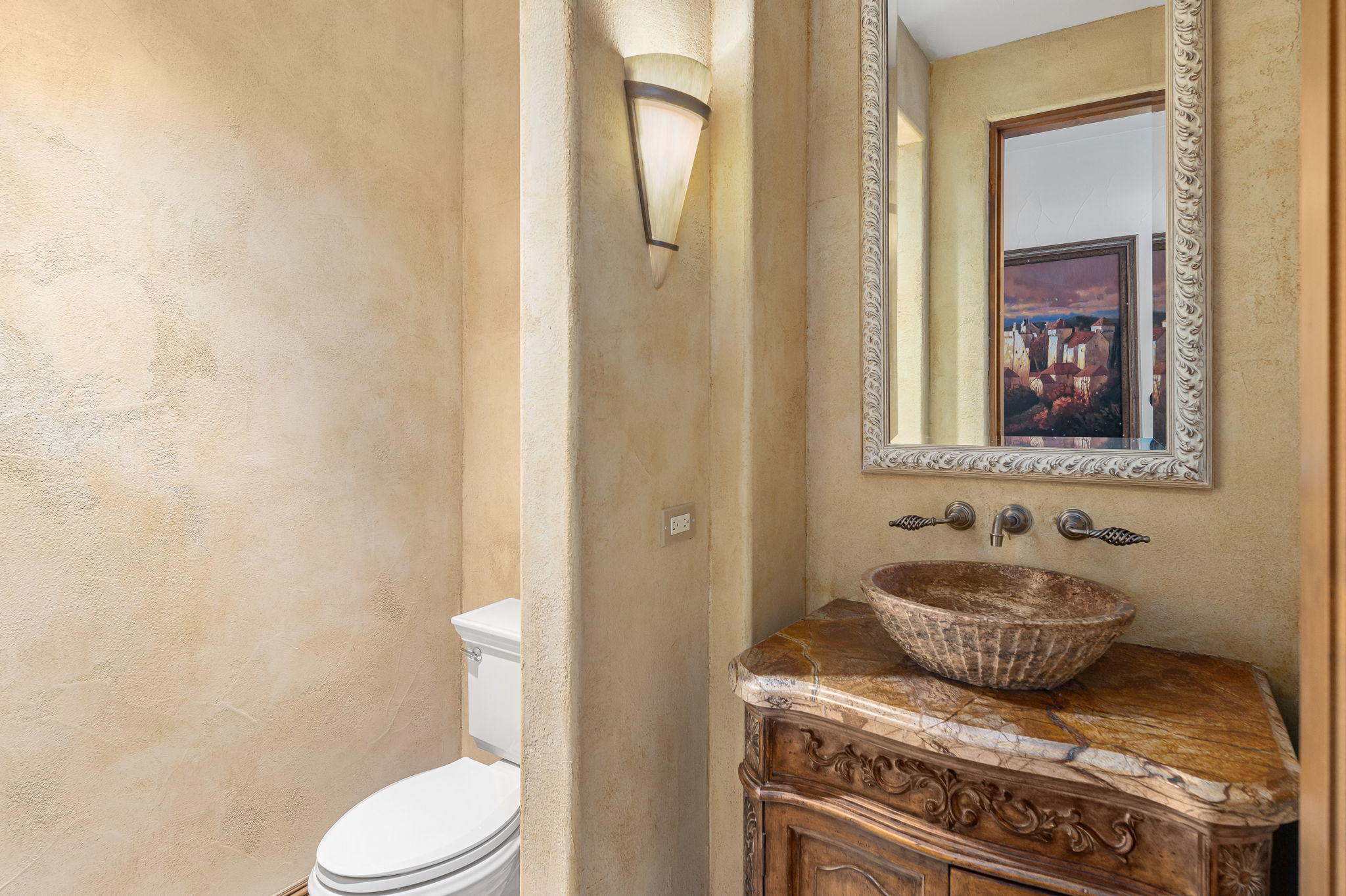 57325 Peninsula Lane La Quinta, CA 92253 - Photo 62 of 66 a bathroom with a granite countertop toilet and mirror