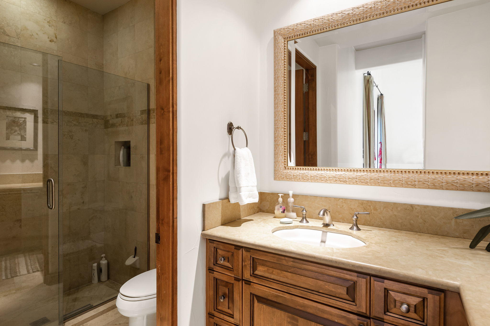 57325 Peninsula Lane La Quinta, CA 92253 - Photo 66 of 66 a bathroom with a granite countertop sink a toilet and shower