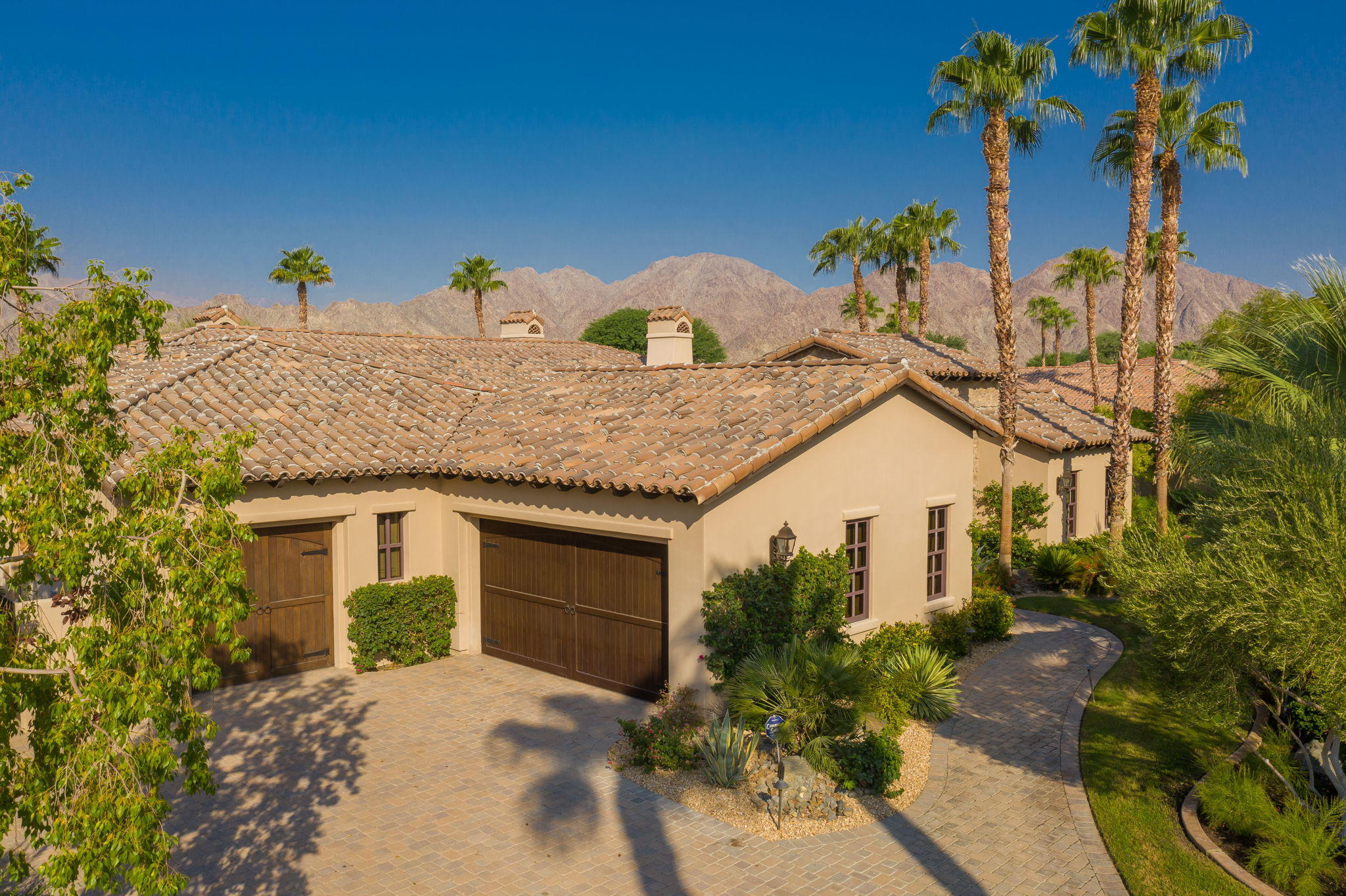 57325 Peninsula Lane La Quinta, CA 92253 - Photo 9 of 66 a front view of a house with a yard