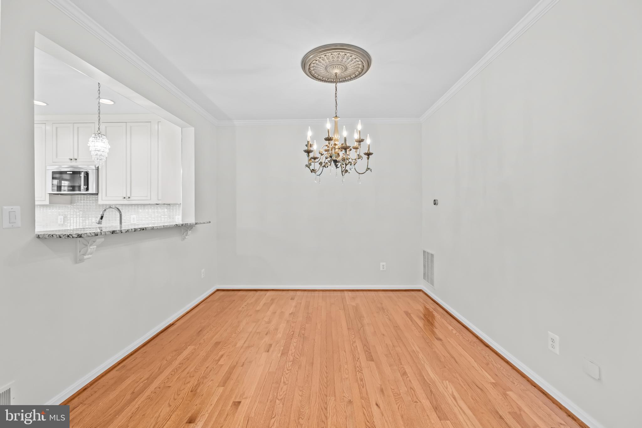 20366 Cloverfield Terrace Sterling, VA 20165 - Photo 18 of 96 a view of a room with wooden floor and staircase