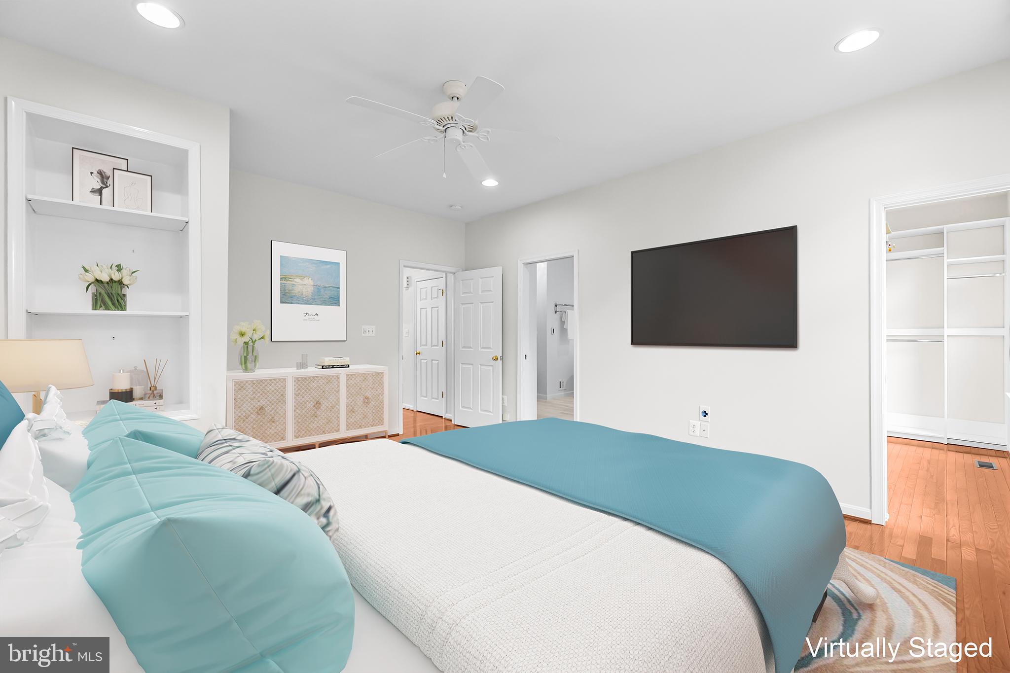 20366 Cloverfield Terrace Sterling, VA 20165 - Photo 20 of 96 a bedroom with a bed and a flat screen tv