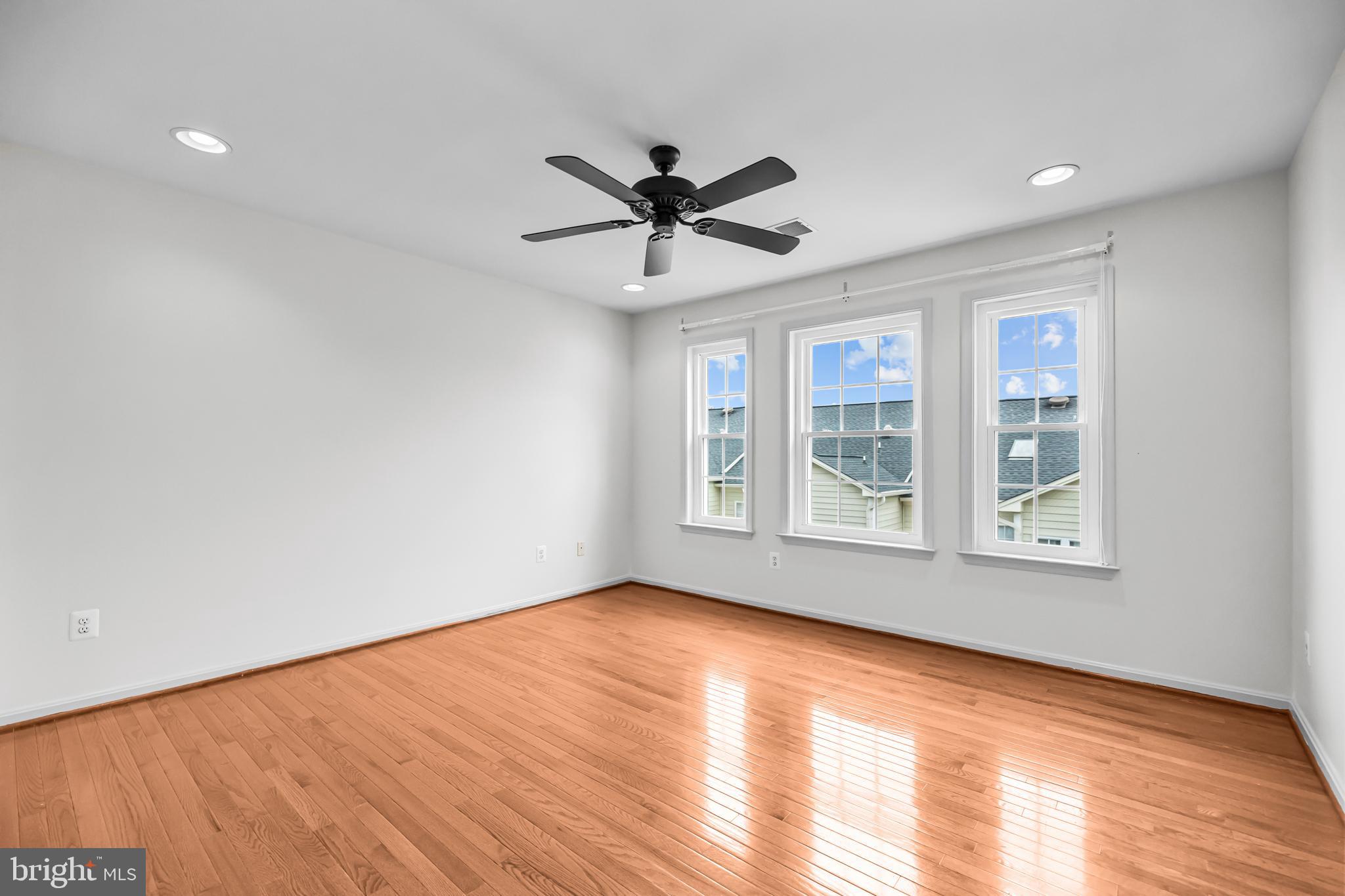20366 Cloverfield Terrace Sterling, VA 20165 - Photo 36 of 96 a view of an empty room with a window and wooden floor