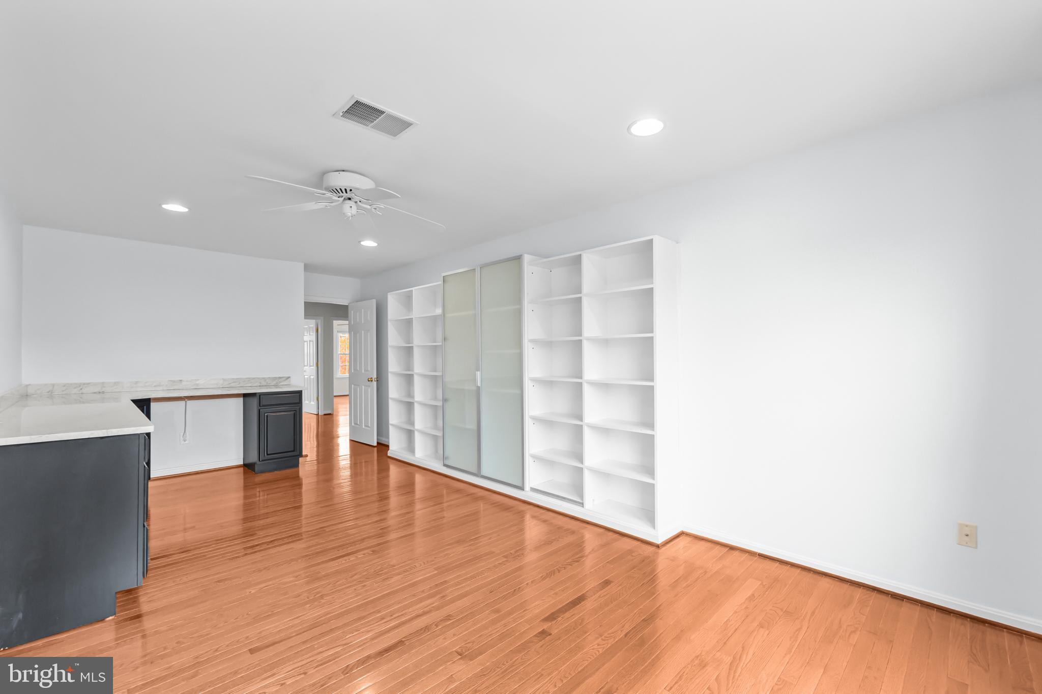 20366 Cloverfield Terrace Sterling, VA 20165 - Photo 50 of 96 a view of empty room with wooden floor and fan
