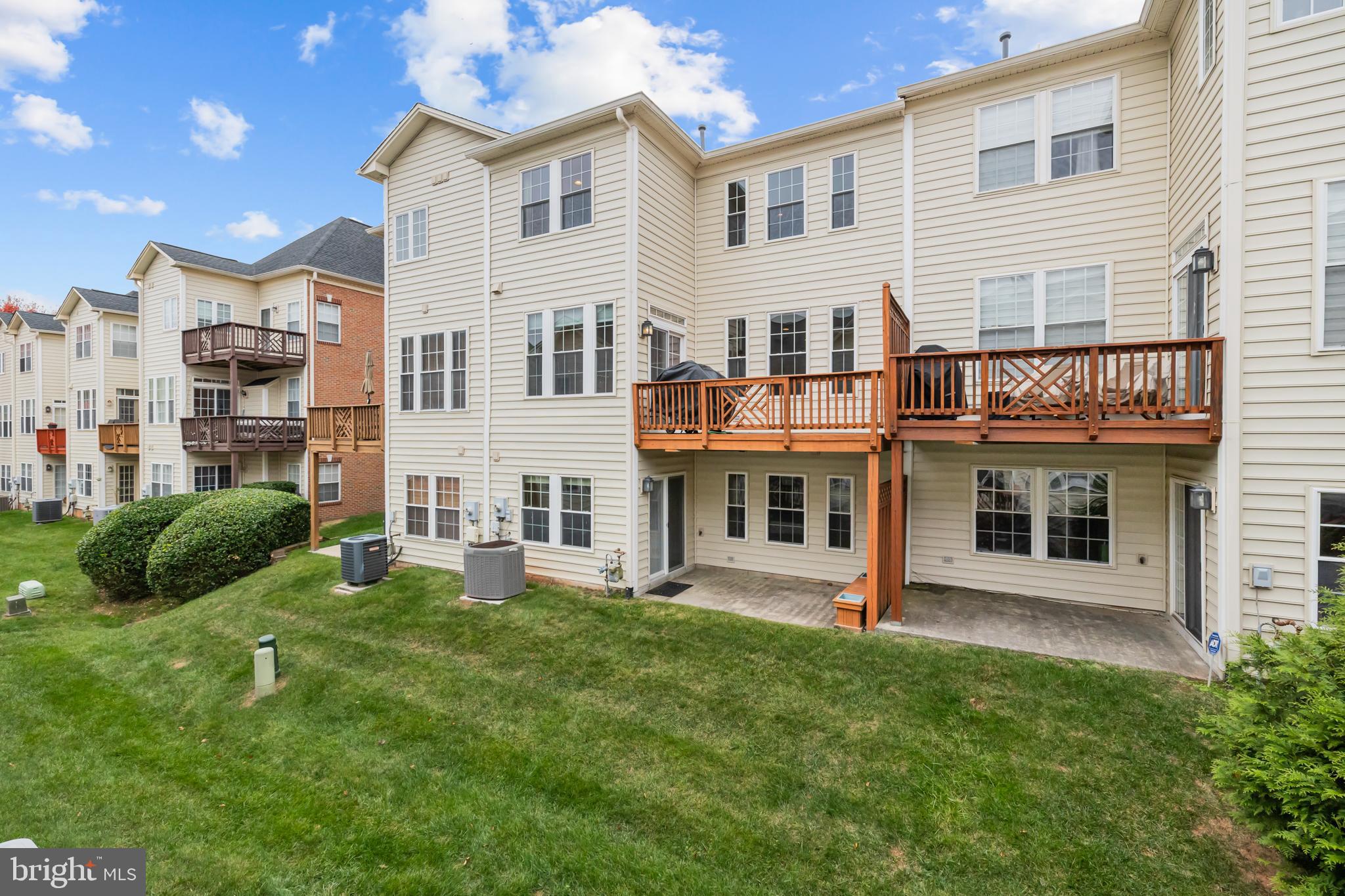 20366 Cloverfield Terrace Sterling, VA 20165 - Photo 71 of 96 a view of a house with a yard and plants