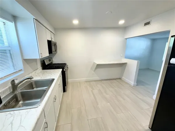 a bedroom with a bed and furniture