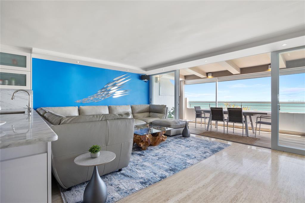 1 Bucaré, Unit 4 San Juan, PR 00913 - Photo 12 of 49 a living room with furniture and a table