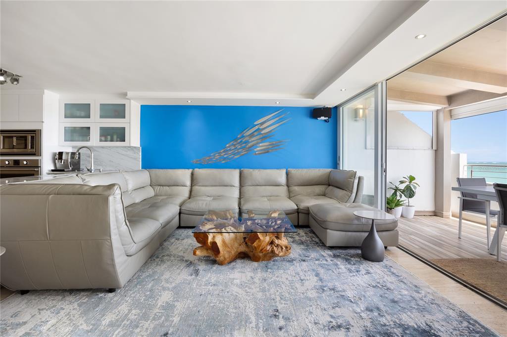 1 Bucaré, Unit 4 San Juan, PR 00913 - Photo 13 of 49 a living room with furniture and a couch