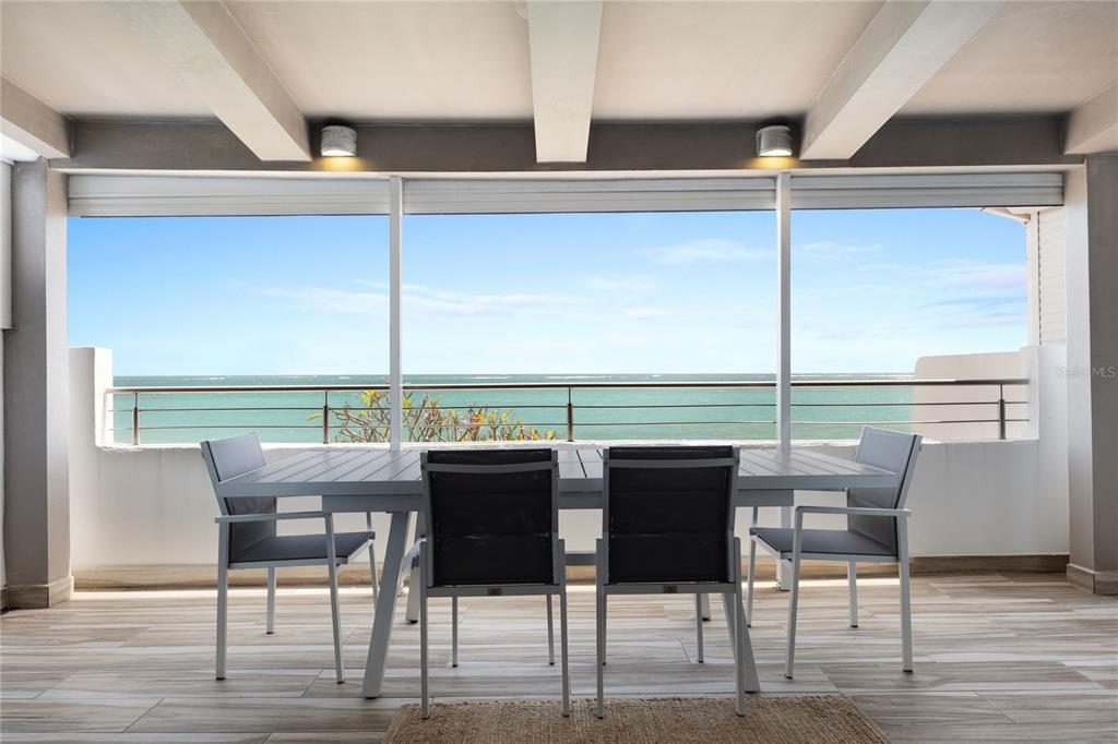 1 Bucaré, Unit 4 San Juan, PR 00913 - Photo 14 of 49 a view of a dining room with furniture and window