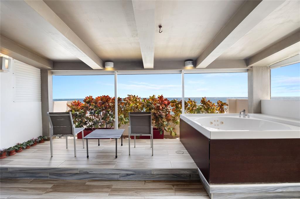 1 Bucaré, Unit 4 San Juan, PR 00913 - Photo 21 of 49 a view dining room with furniture and chandelier