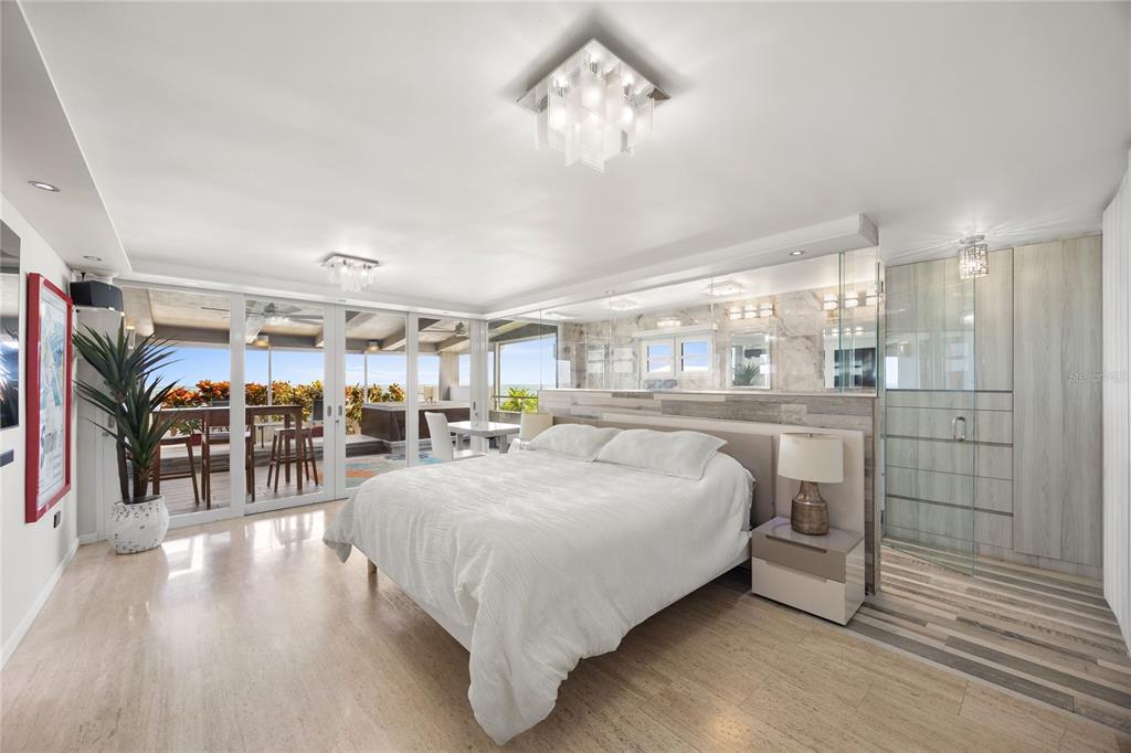 1 Bucaré, Unit 4 San Juan, PR 00913 - Photo 23 of 49 a living room with a bed and glass walk in closet