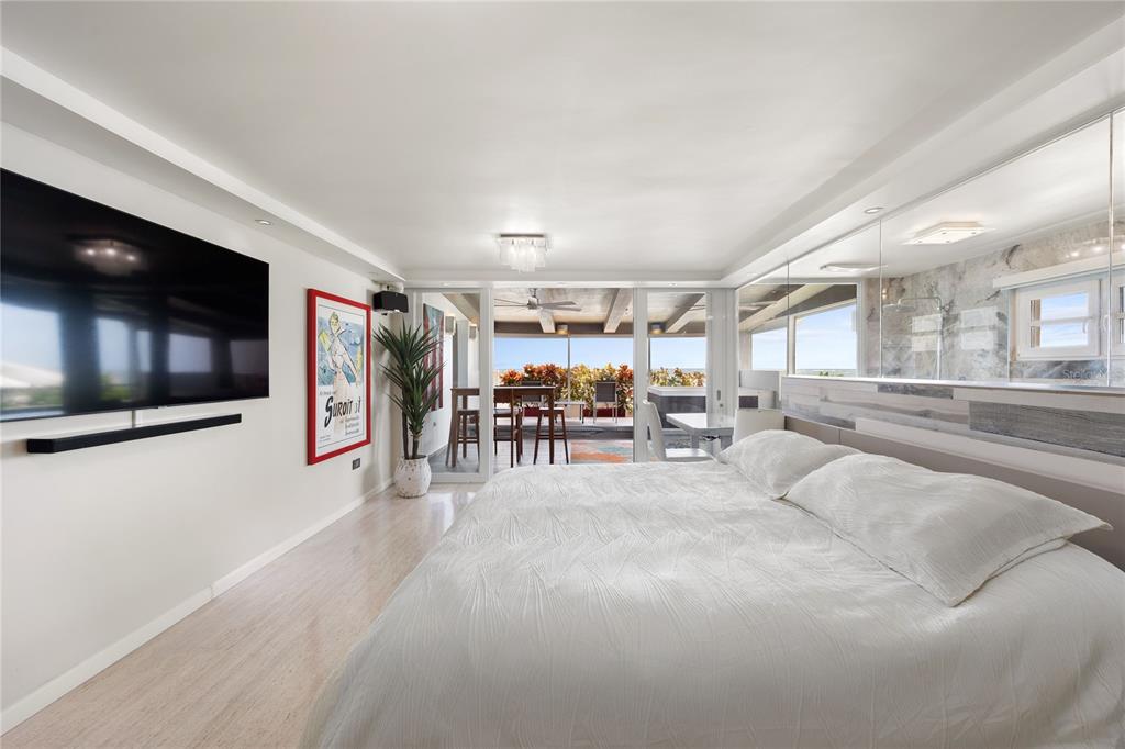 1 Bucaré, Unit 4 San Juan, PR 00913 - Photo 24 of 49 a living room with furniture and a flat screen tv