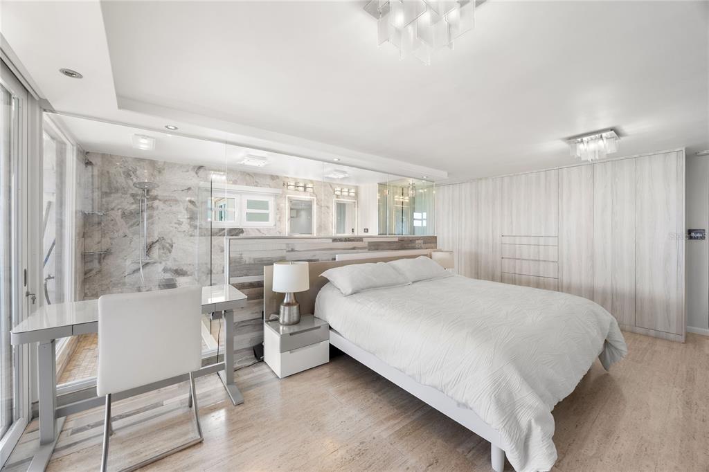 1 Bucaré, Unit 4 San Juan, PR 00913 - Photo 25 of 49 a bedroom with a large bed and a table chair