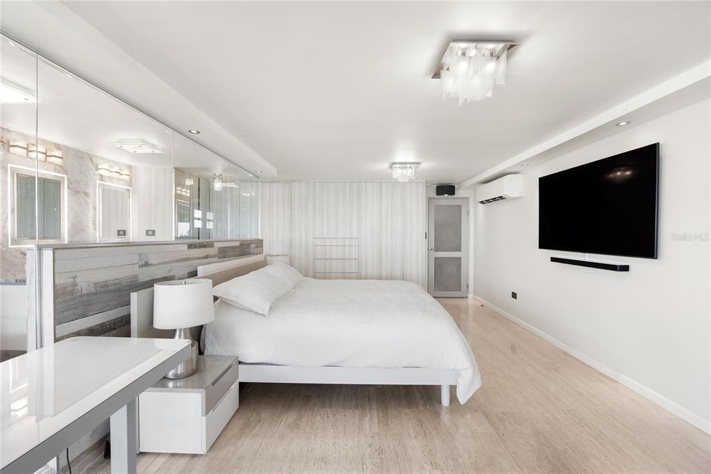 1 Bucaré, Unit 4 San Juan, PR 00913 - Photo 26 of 49 a bedroom with a bed and a flat screen tv