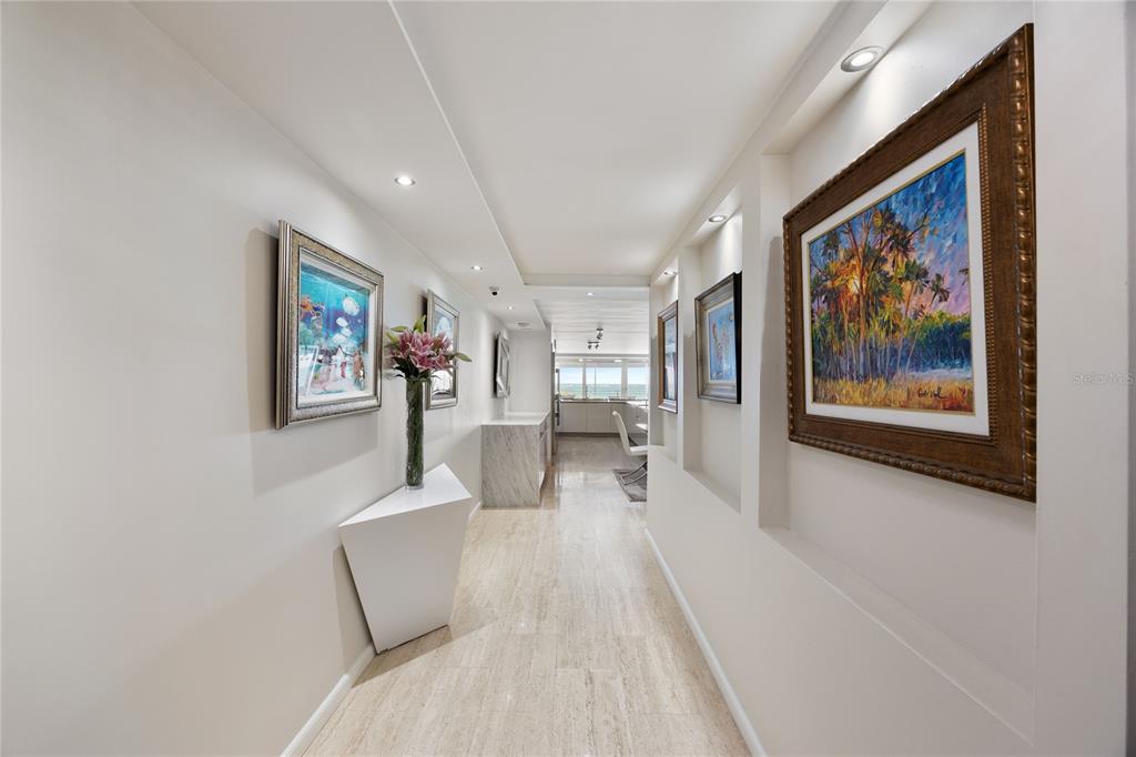1 Bucaré, Unit 4 San Juan, PR 00913 - Photo 3 of 49 a view of a hallway with wooden floor and furniture