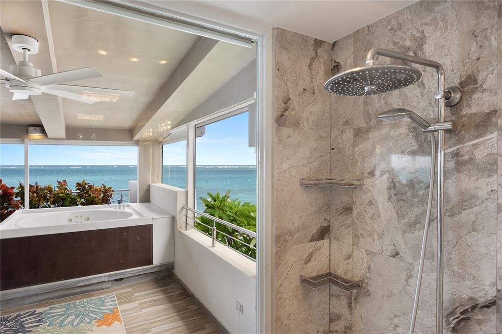 1 Bucaré, Unit 4 San Juan, PR 00913 - Photo 31 of 49 a bathroom with a sink mirror and a shower