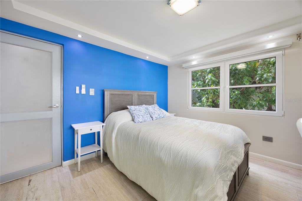 1 Bucaré, Unit 4 San Juan, PR 00913 - Photo 34 of 49 a large bed sitting in a bedroom next to a window