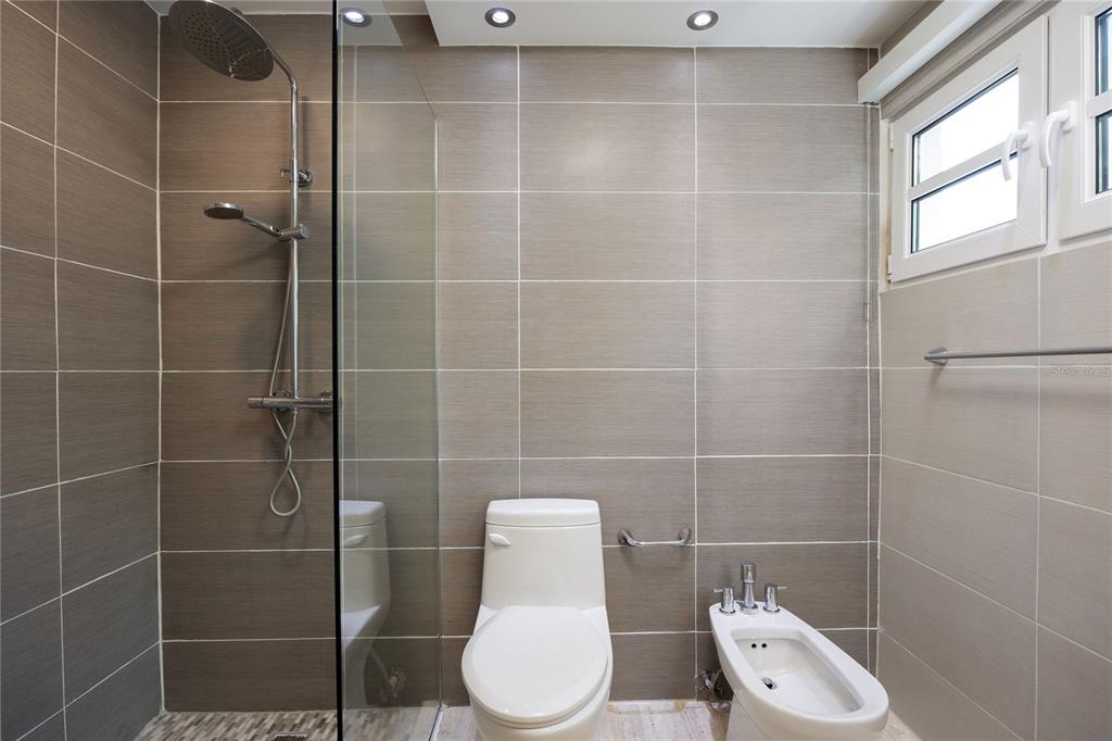 1 Bucaré, Unit 4 San Juan, PR 00913 - Photo 36 of 49 a bathroom with a toilet and a shower