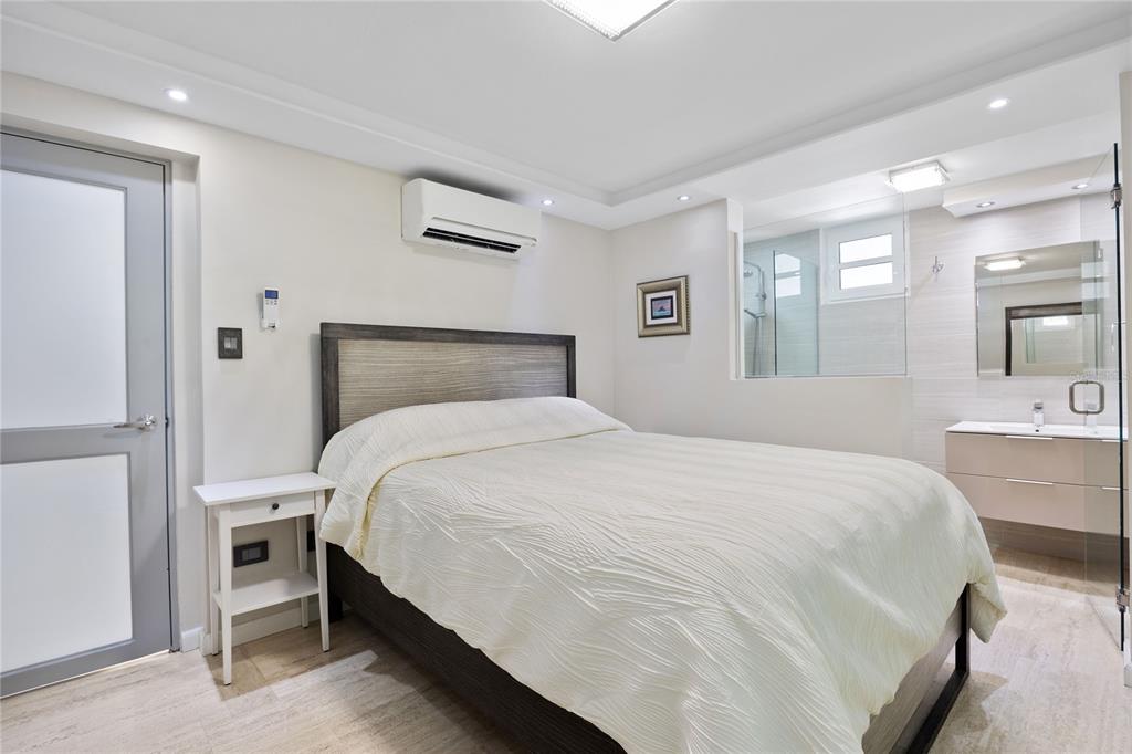 1 Bucaré, Unit 4 San Juan, PR 00913 - Photo 37 of 49 a bedroom with a bed and window