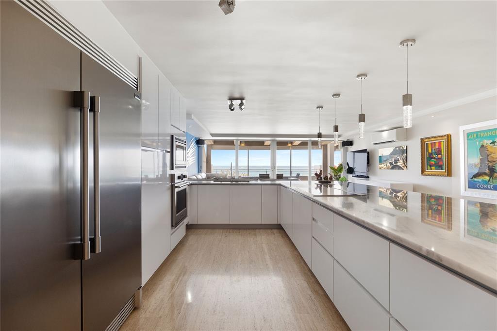 1 Bucaré, Unit 4 San Juan, PR 00913 - Photo 9 of 49 a large white kitchen with a large window