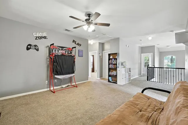 a view of a livingroom with furniture and a flat screen tv