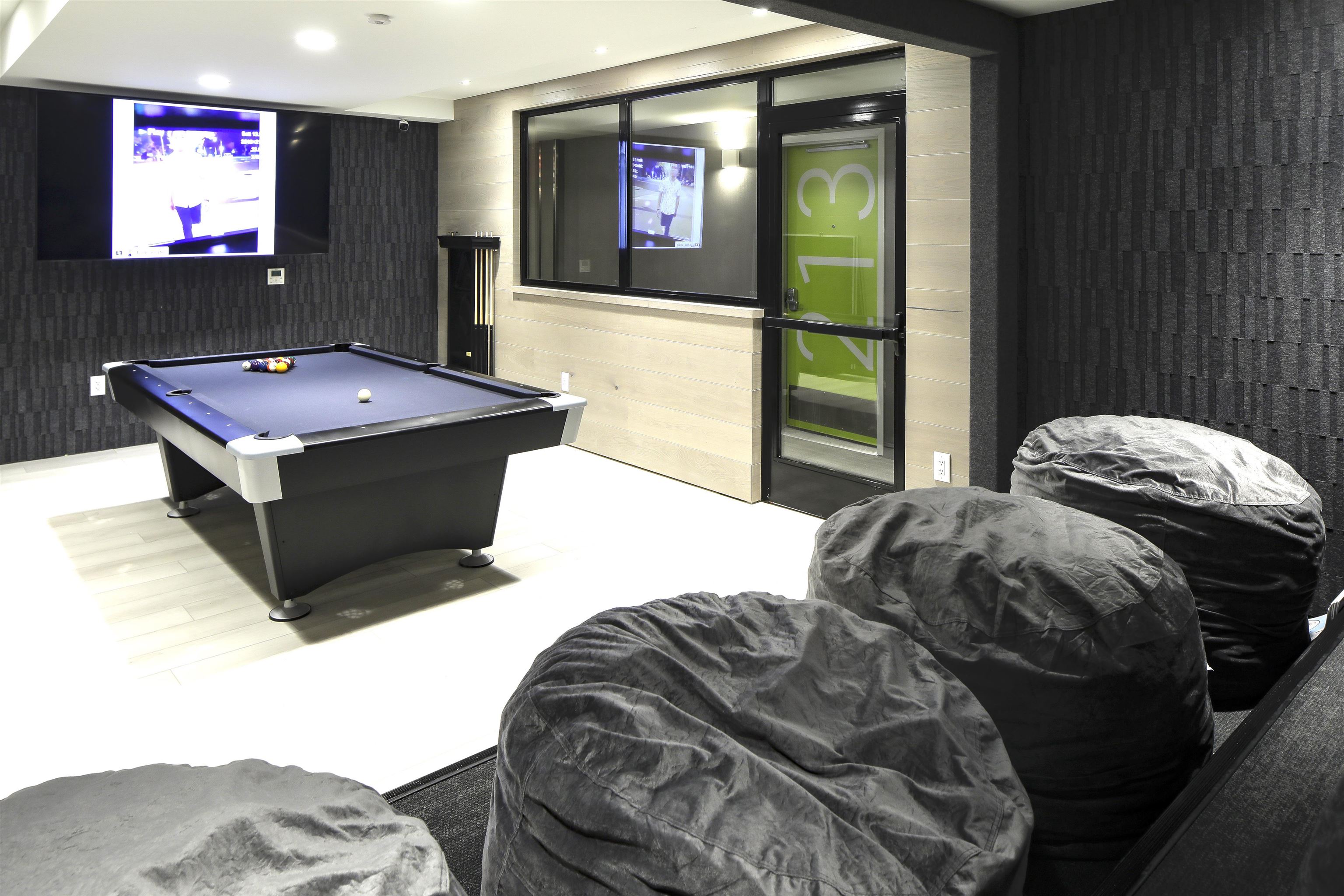 190 Academy Street, Unit 402 Jersey City, NJ 07306 - Photo 12 of 16 a bedroom with a bed and a flat screen tv