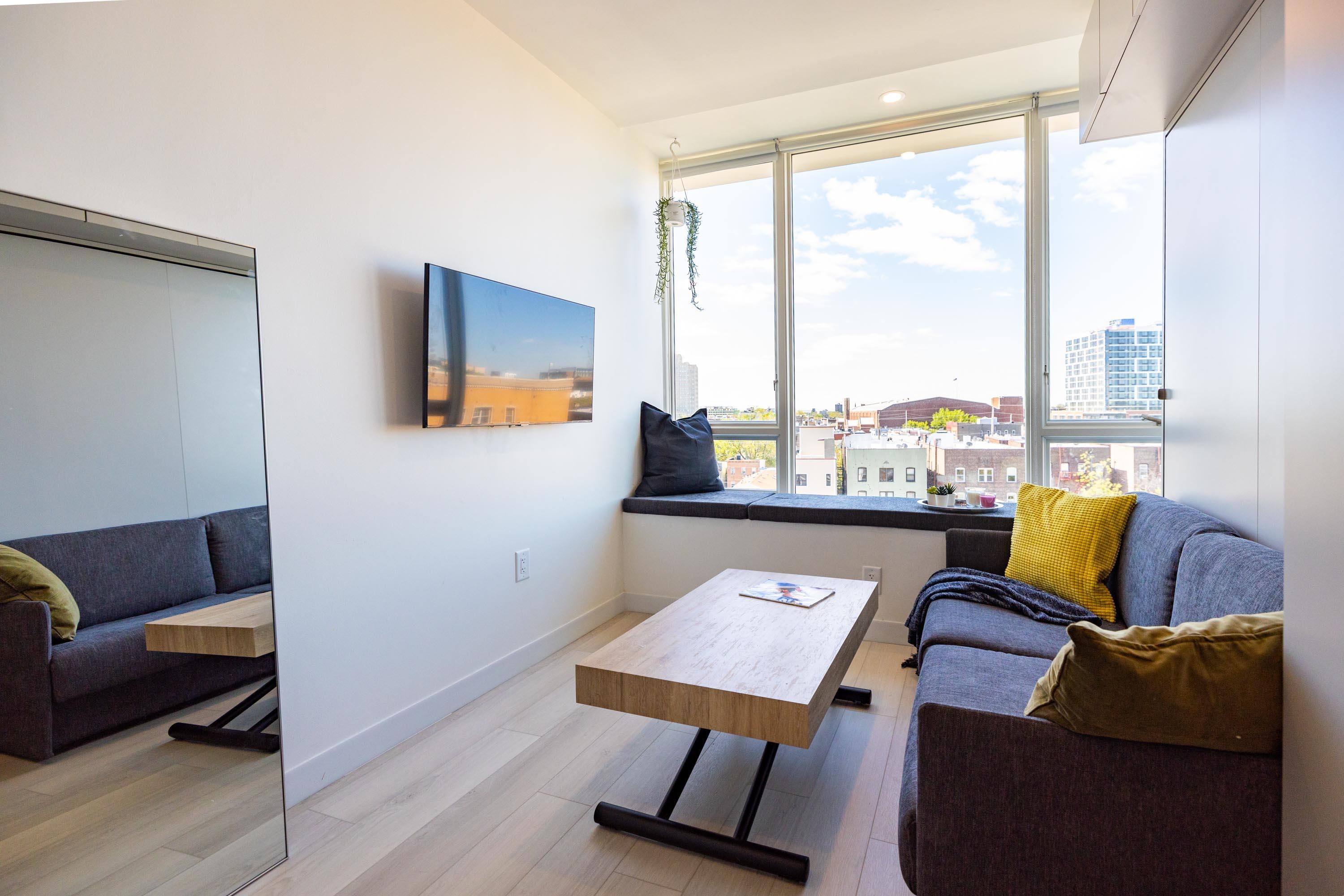 190 Academy Street, Unit 402 Jersey City, NJ 07306 - Photo 3 of 16 a living room with furniture and a window