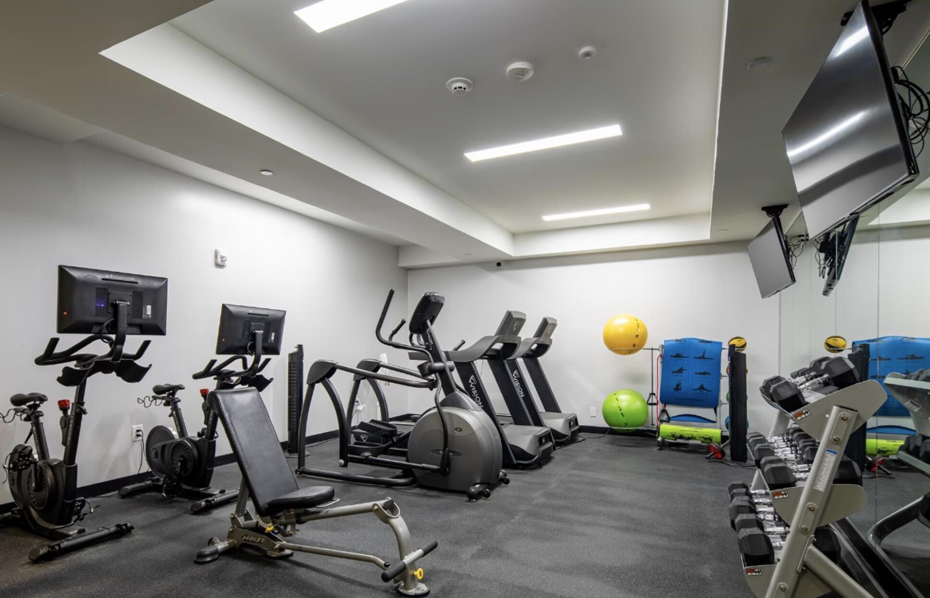 190 Academy Street, Unit 402 Jersey City, NJ 07306 - Photo 8 of 16 a view of a room with gym equipment