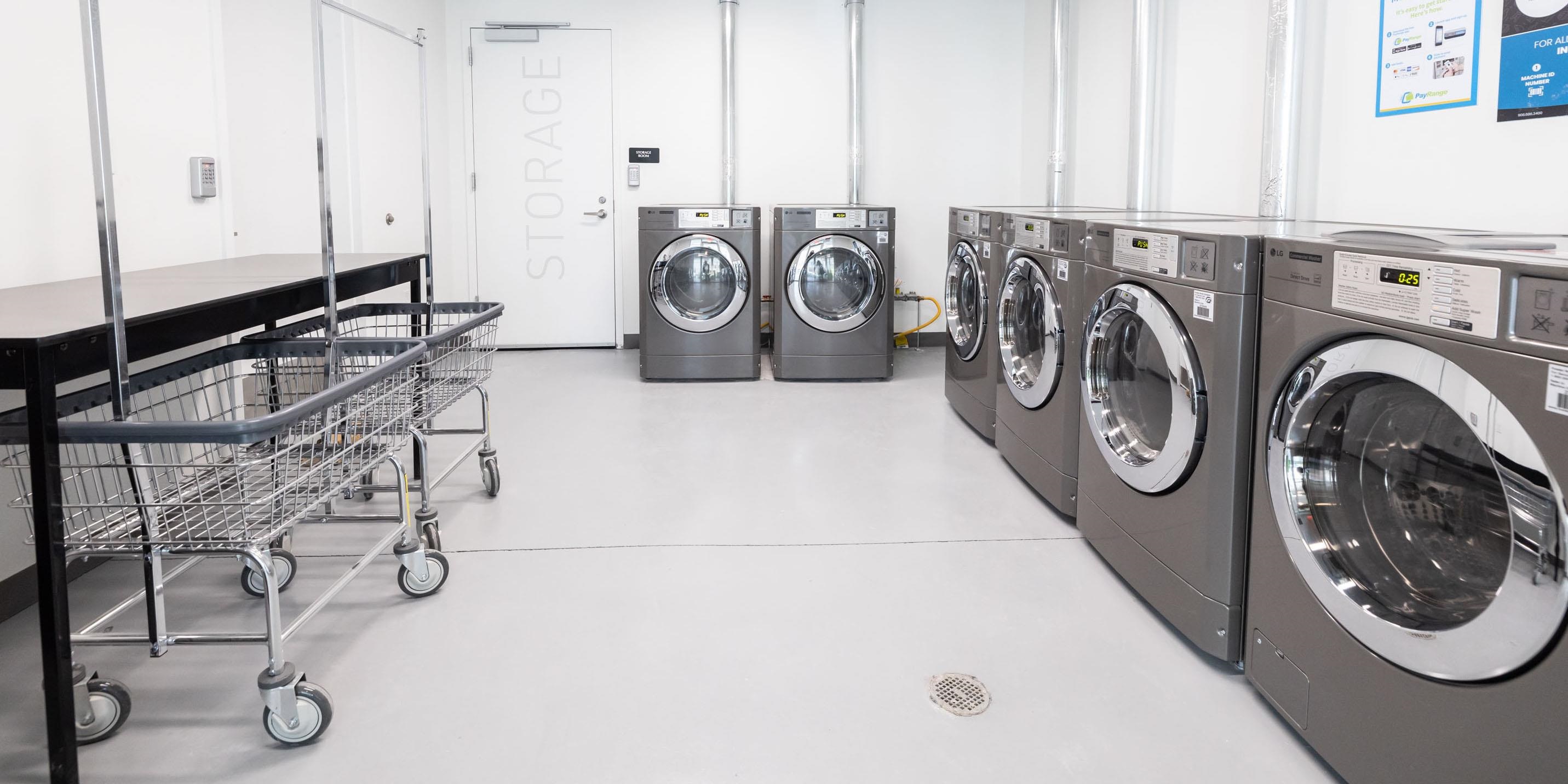 190 Academy Street, Unit 402 Jersey City, NJ 07306 - Photo 10 of 16 a utility room with dryer and washer