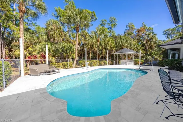 a view of a glass door with a yard from the shower