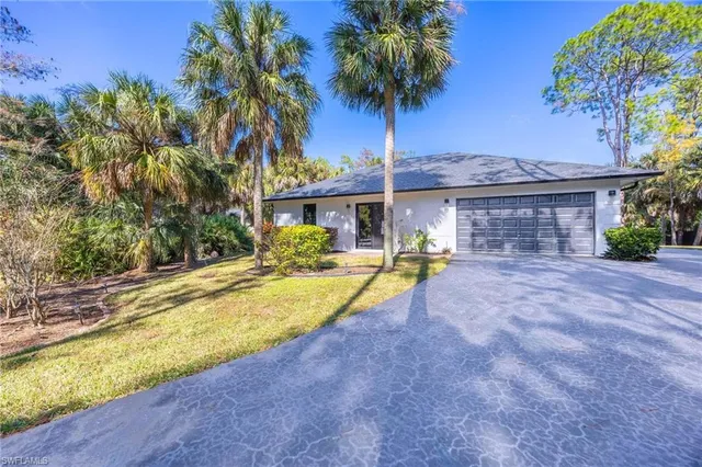 a view of a dining room with furniture wooden floor and chandelier