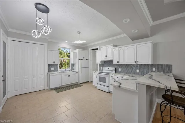 a view of a room with window and carpet