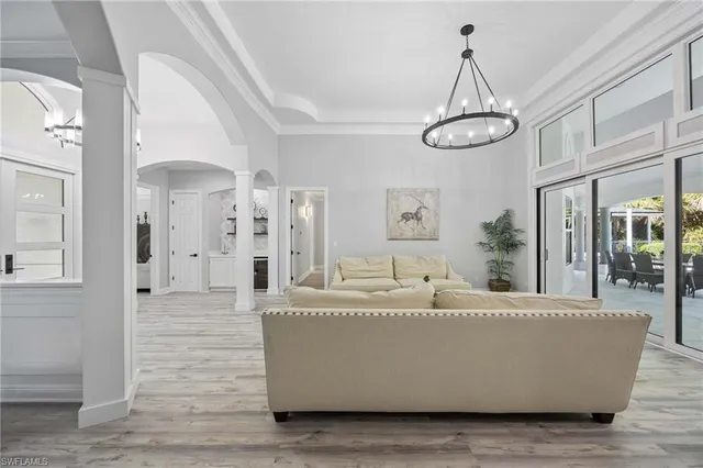 a living room with chandelier