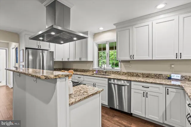a kitchen with a sink stove and refrigerator