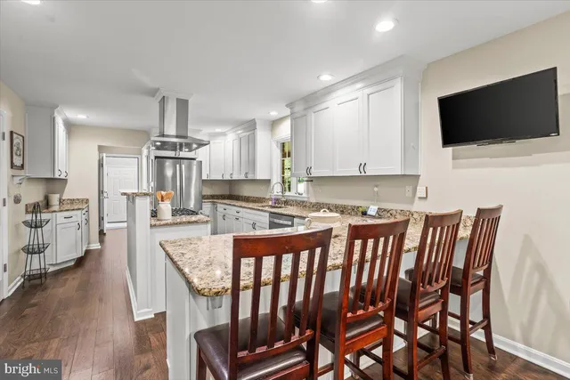 a bedroom with furniture and a fireplace