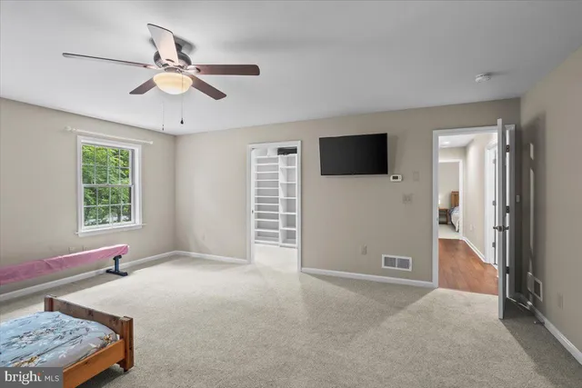 a view of room with workspace and a window