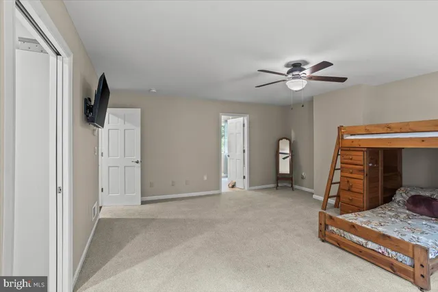 a bathroom with a double vanity sink toilet and shower