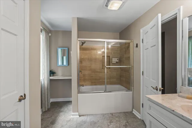 a bed room with a bed and a window