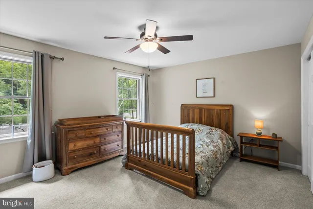 a bedroom with bed and a window