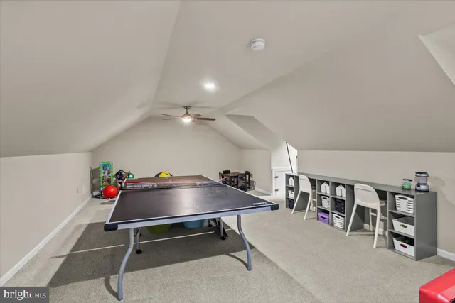 a view of a house with backyard porch and sitting area