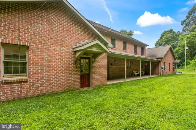 a front view of a house with yard