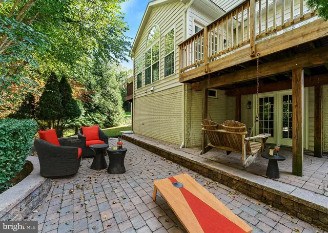 a view of a chair and tables in the balcony