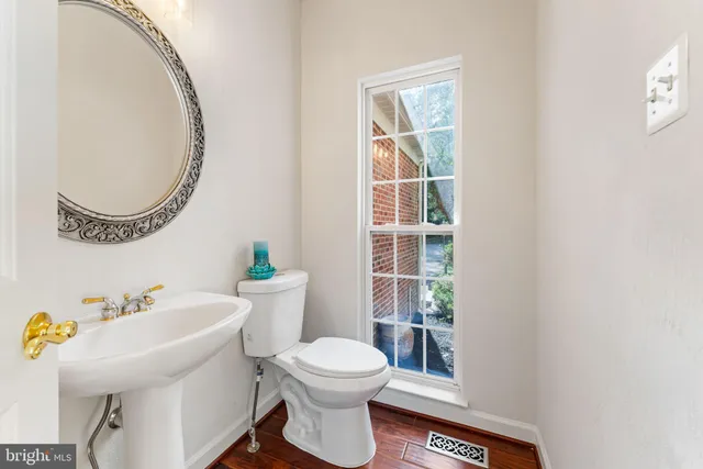 a bathroom with a toilet and a sink