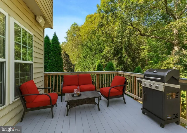 a roof deck with a table and chairs