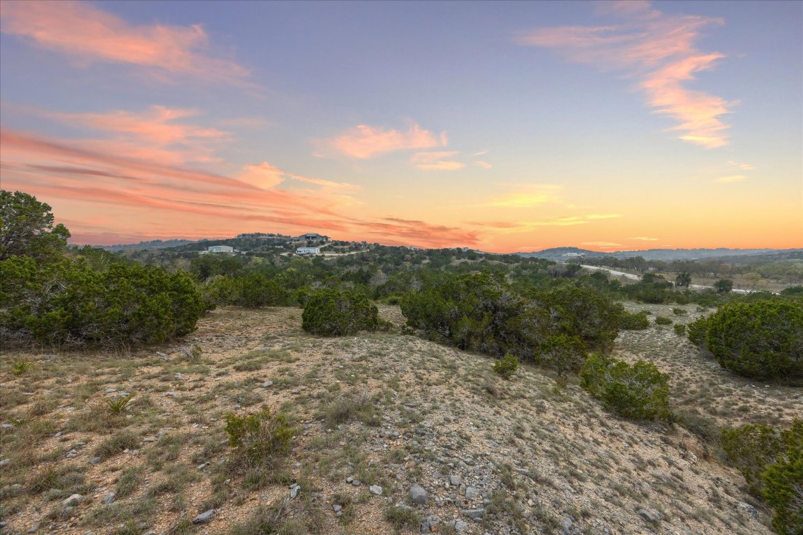 Lot 45 Falling Oak Trail Blanco, TX 78606 - Photo 4 of 11 a view of a outdoor space with green field and mountains