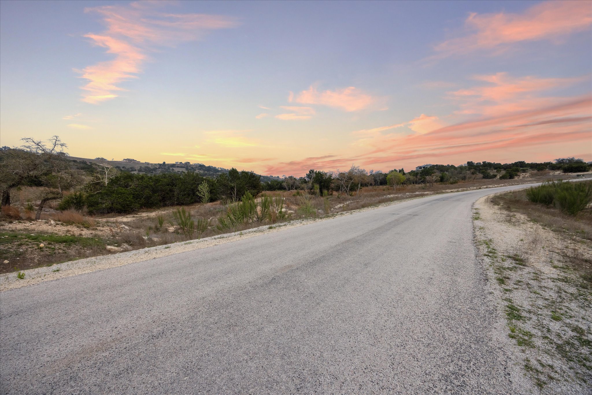 Lot 45 Falling Oak Trail Blanco, TX 78606 - Photo 10 of 11 a view of a road with a big yard
