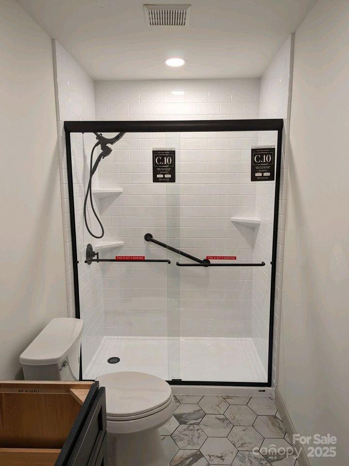 7019 Walnut Ridge Court Charlotte, NC 28273 - Photo 22 of 29 a bathroom with a granite countertop sink toilet and shower